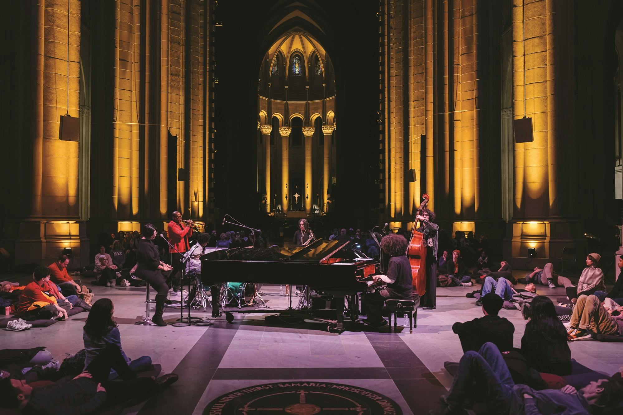 Trumpeter Sean Jones performing with a group of musicians at the Cathedral Church of St. John the Divine.