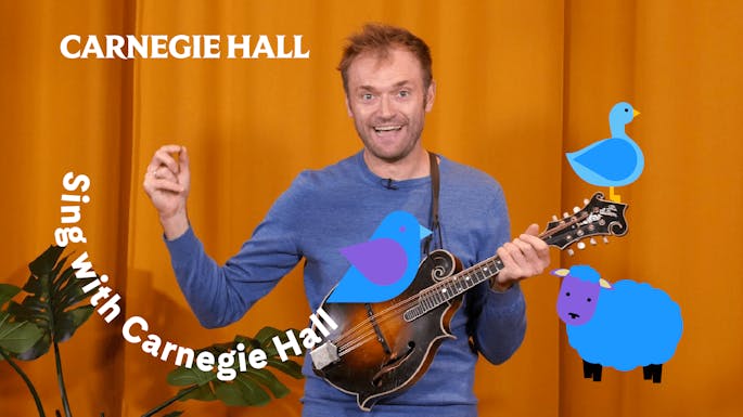 Chris Thile holding a mandolin
