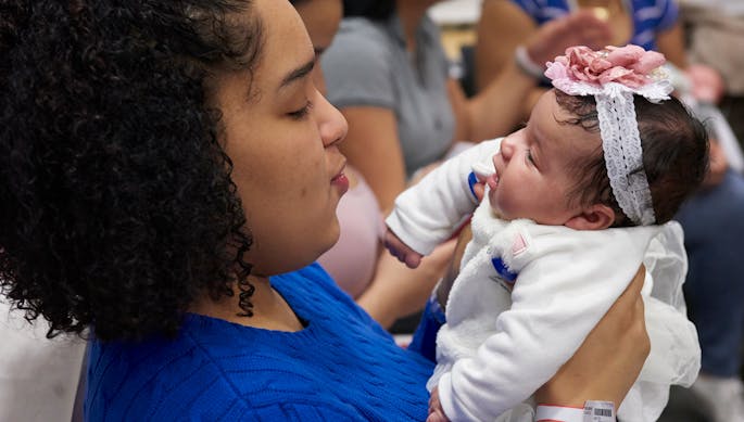 A mother looks into her baby’s eyes