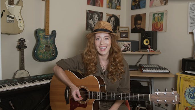 Bridget Barkan with a guitar