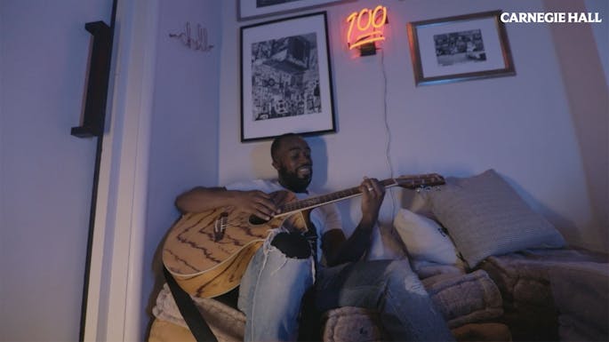 Orson Benjamin playing guitar