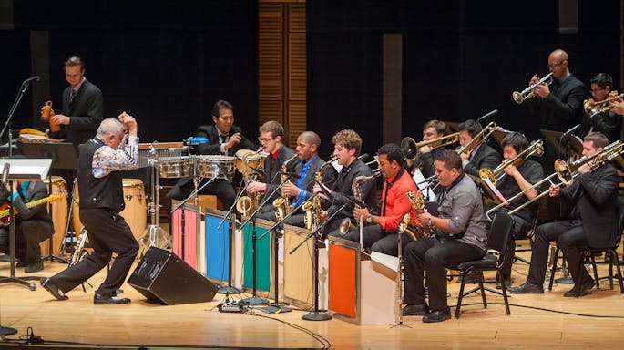 Paquito D’Rivera conducts members of his ensemble and workshop participants in a concert.