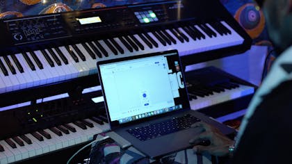 Two keyboards and a Macbook