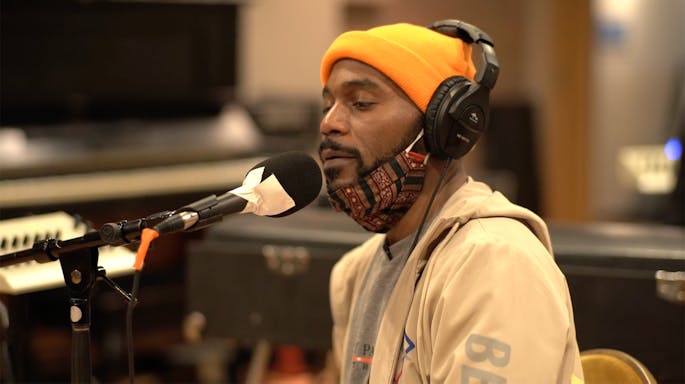 Chen recording vocals into a microphone