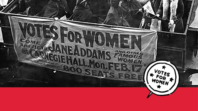 A group of women in an open-roof vehicle, with a sign that says "Votes for Women Come and hear Jane Addams and other famous women at Carnegie Hall Mon. Feb. 17 800 seats free