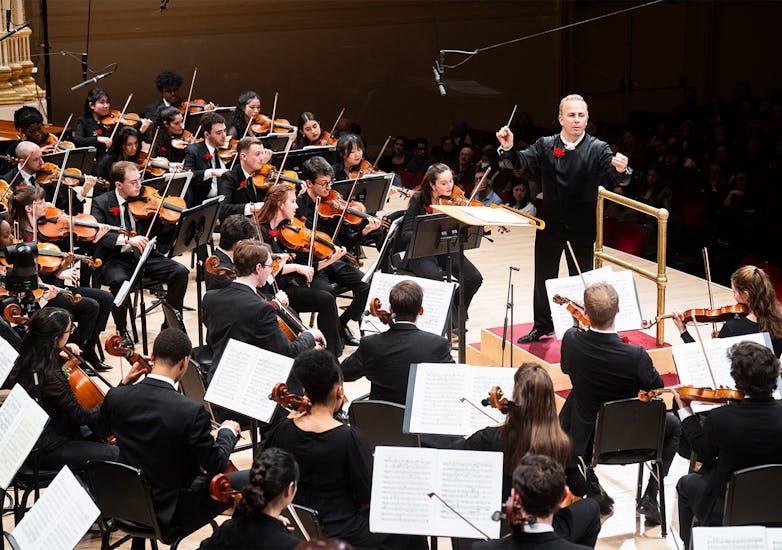 Yannick Nézet-Séguin conducting the NYO-USA All-Stars on stage