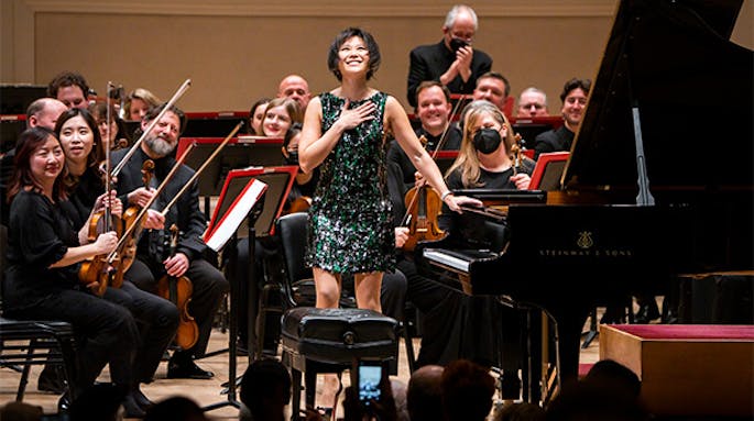 Yuja Wang taking a bow, with the Philadelphia Orchestra