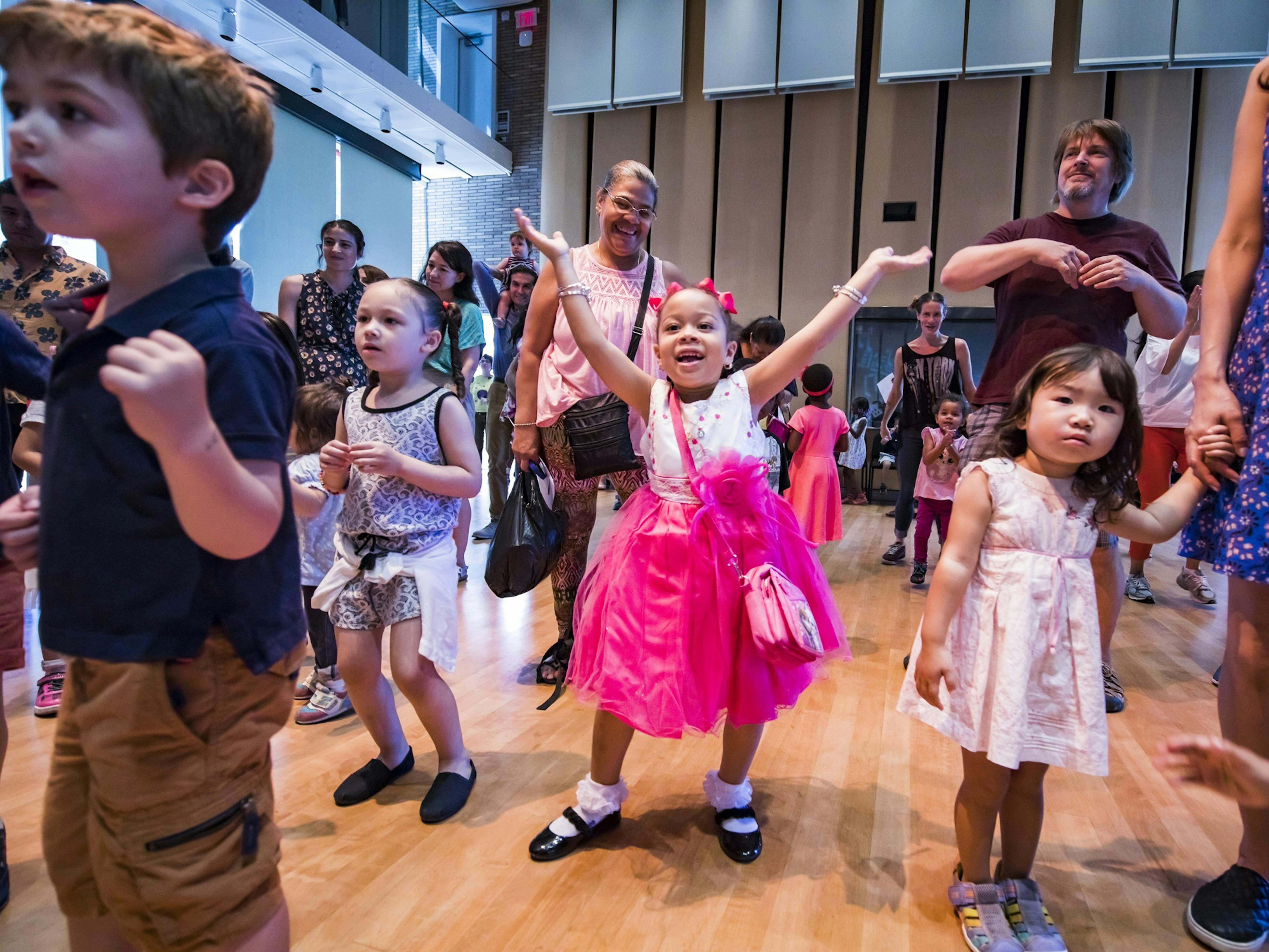 Children and their families dance during the Weill Music Institute's Fall Family Day at Carnegie Hall.
