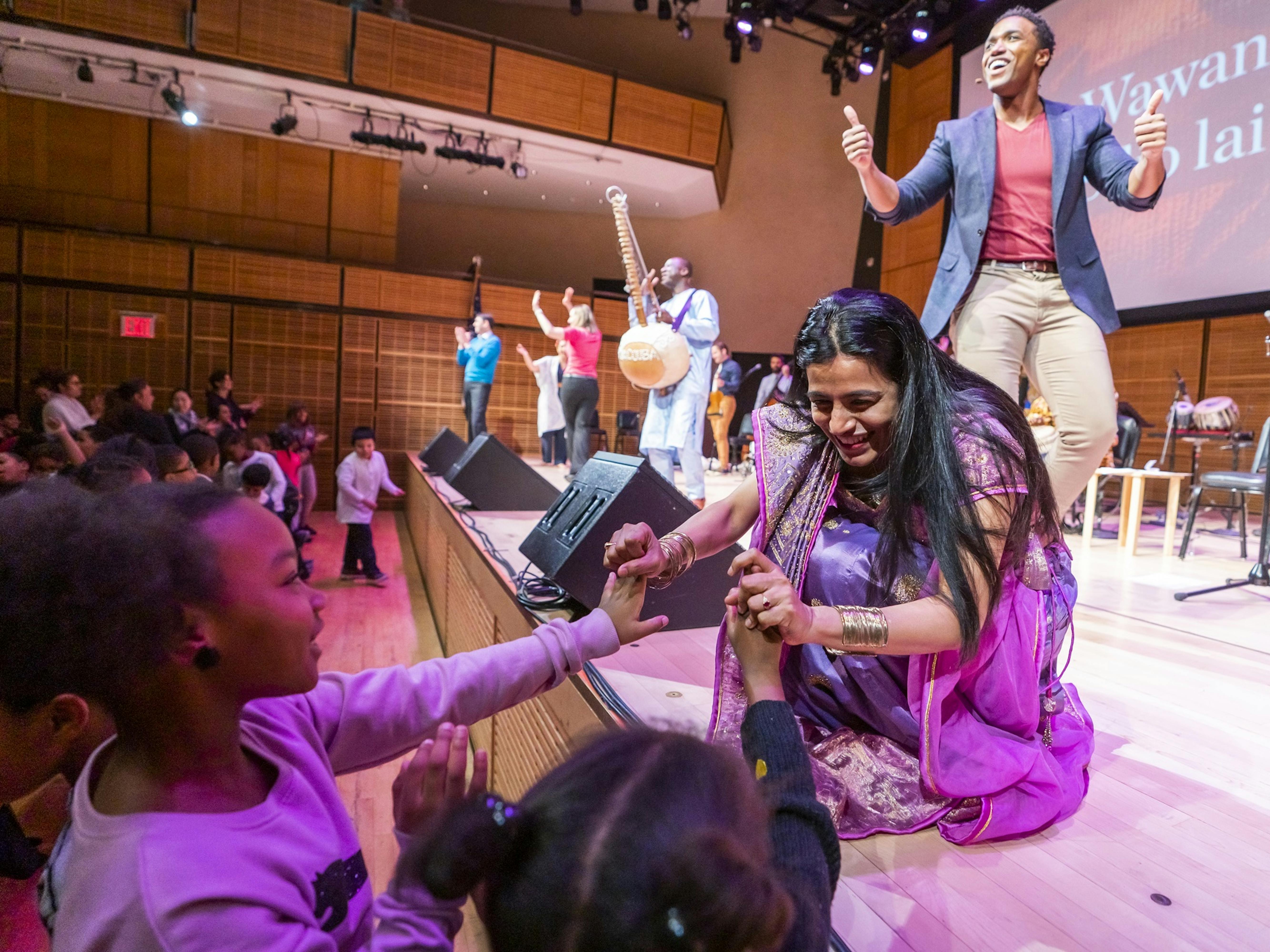 Falu Shah and L. Steven Taylor interact with students participating in Musical Explorers