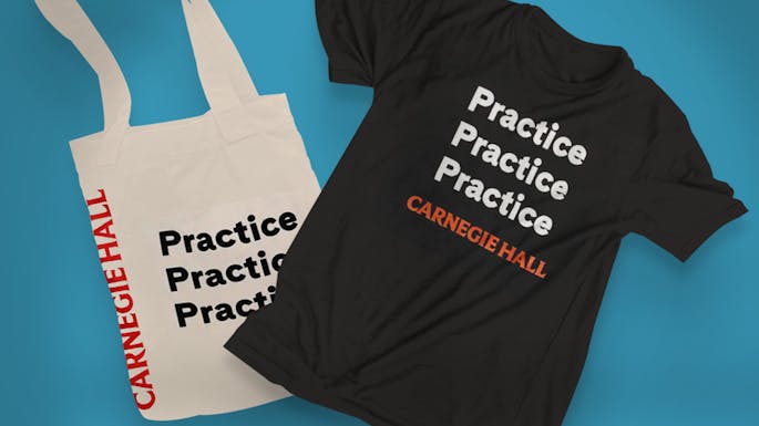 A tote bag and a shirt with the text "Practice Practice Practice Carnegie Hall" printed on them