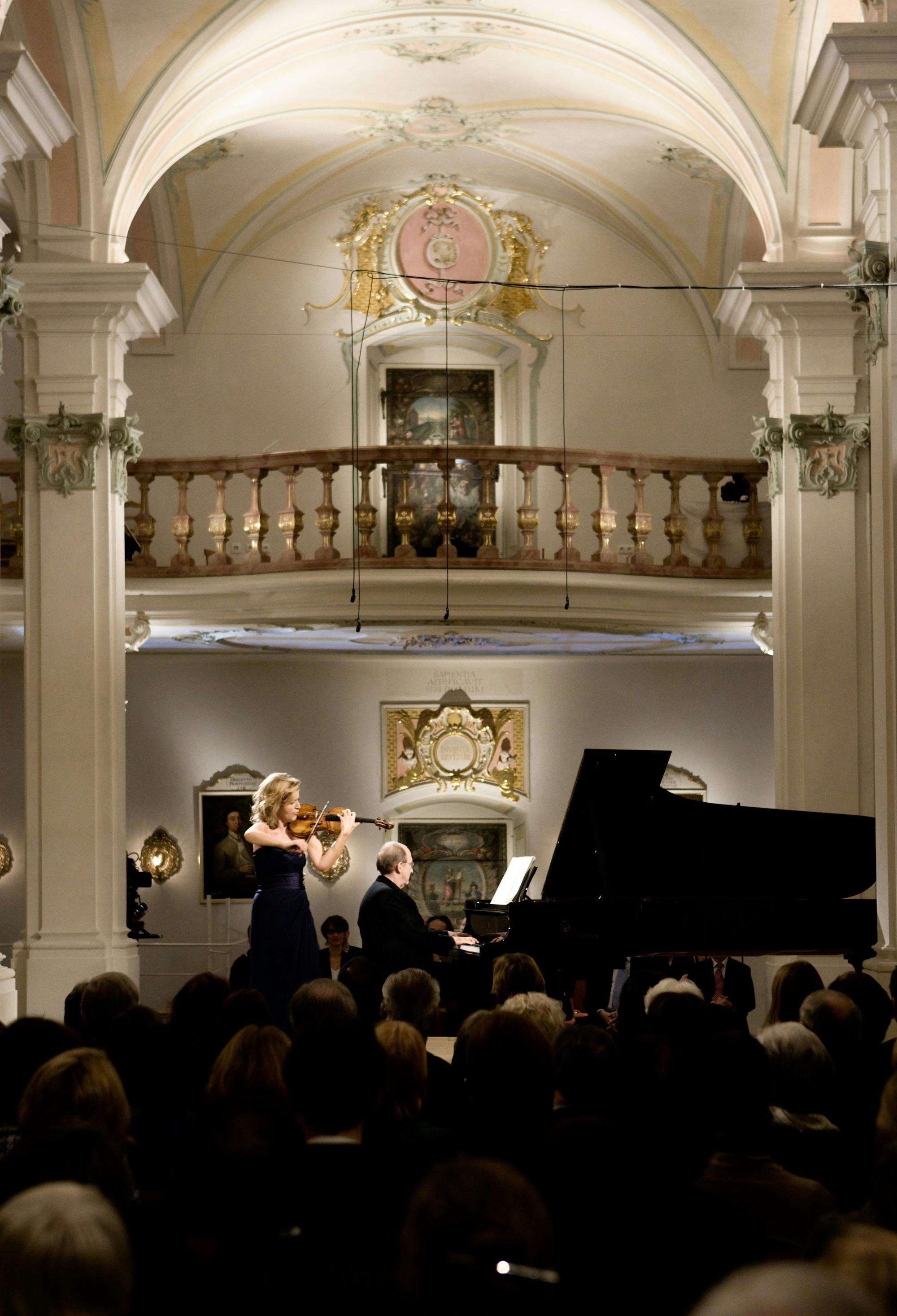 Anne-Sophie Mutter and Lambert Orkis performing on stage in front of an audience.