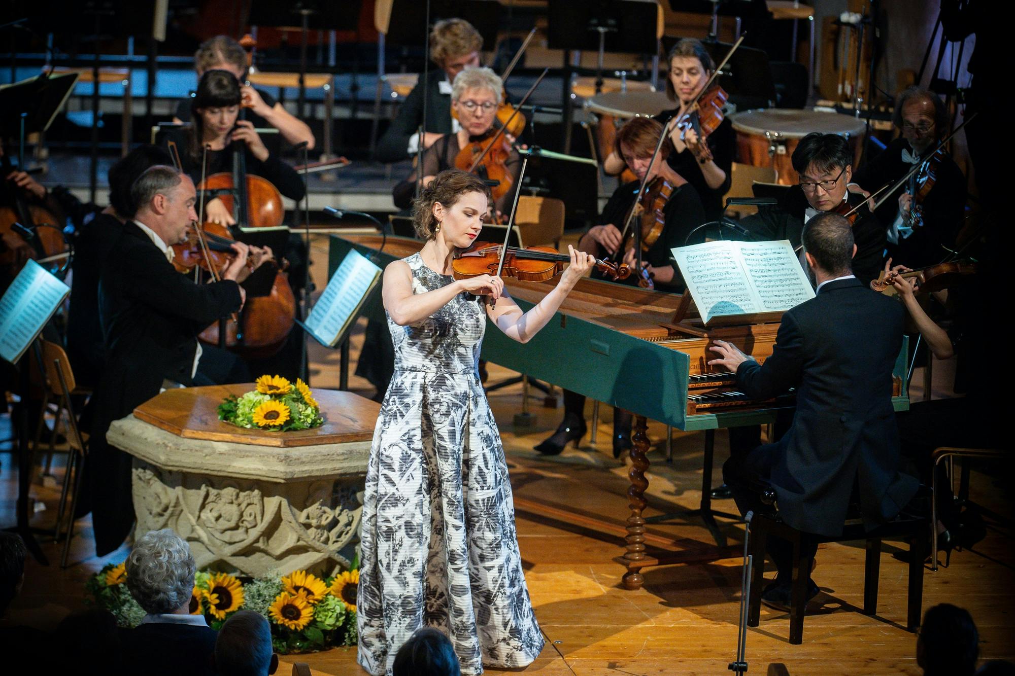 Hilary Hahn playing the violin with keyboard and string instruments.