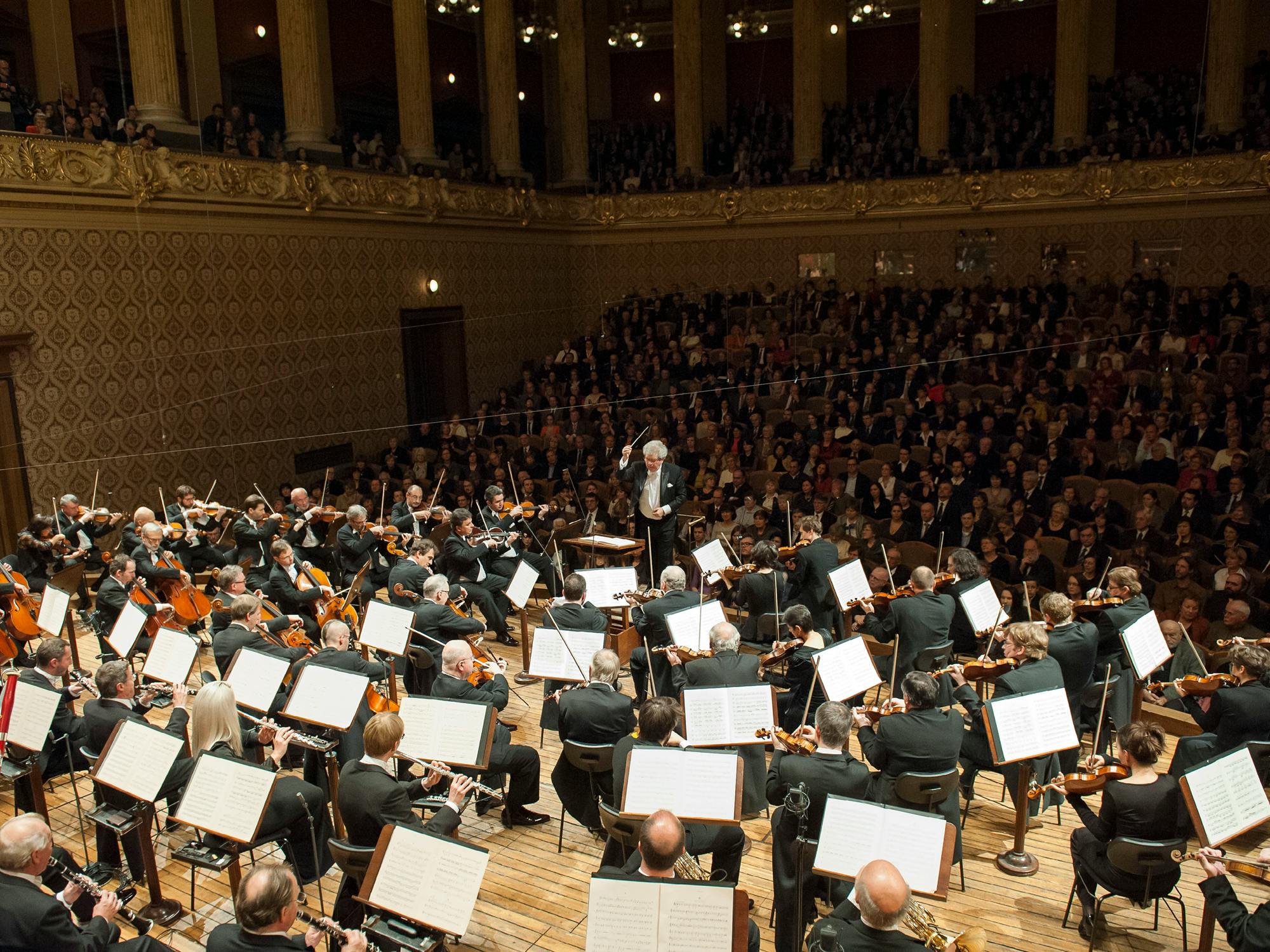 Jiří Bělohlávek and the Czech Philharmonic performing on stage
