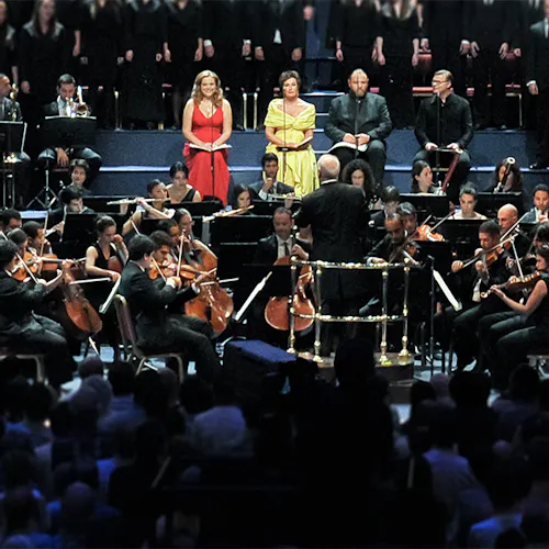 Vocalists and orchestras performing on stage