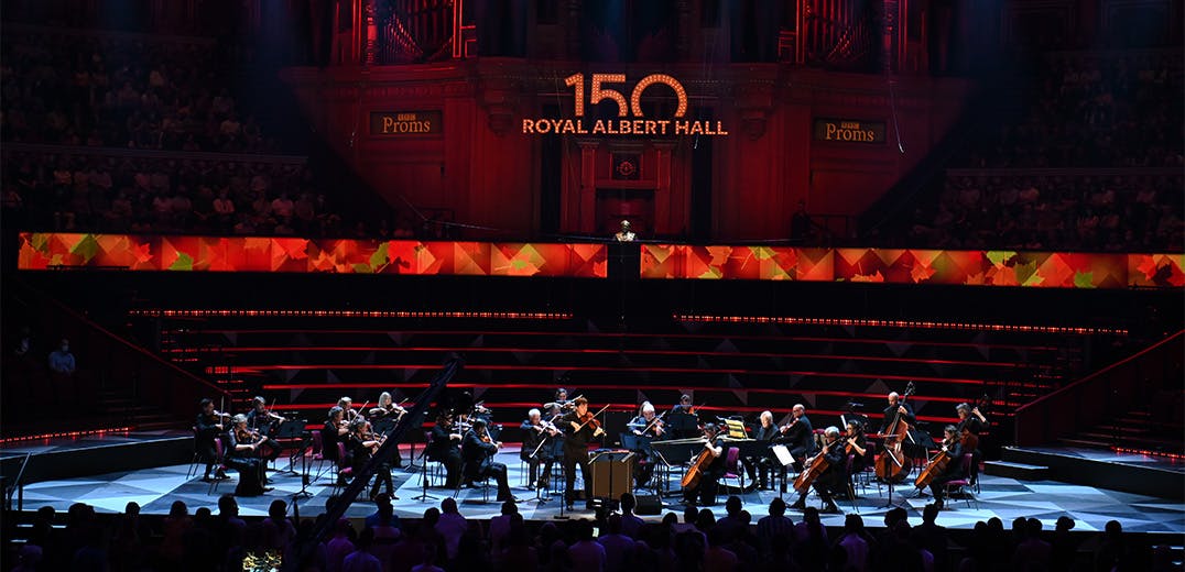 Joshua Bell and a string ensemble performing on stage