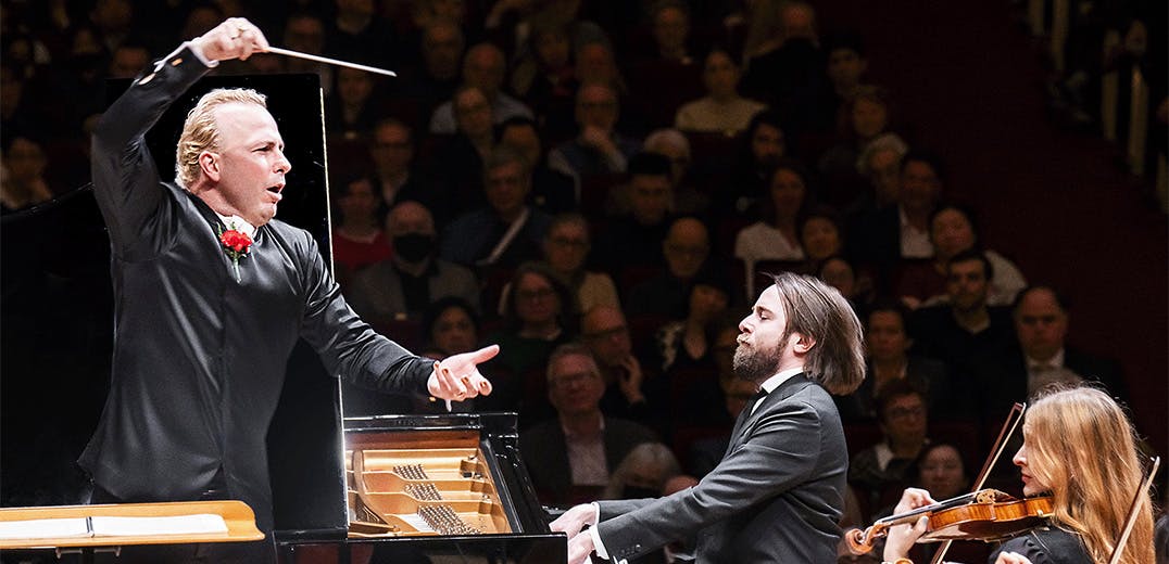 Yannick Nézet-Séguin conducting, Daniil Trifonov playing the piano, and a violinist playing the violin.