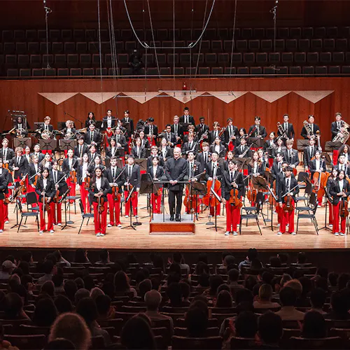 Gianandrea Noseda and NYO-USA on stage standing for applause