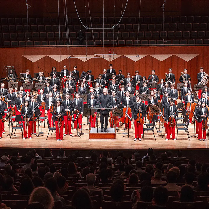 Gianandrea Noseda and NYO-USA on stage standing for applause