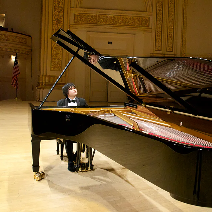 Nobuyuki Tsujii playing the piano on stage